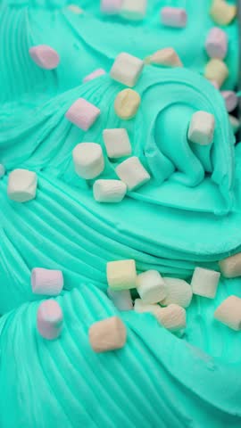 Ice cream with light marshmallows in iron container.