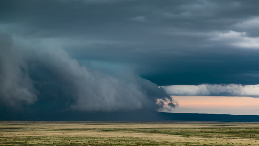 A shelf cloud races across a meadow in southeastern Colorado. Royalty-Free Stock Footage #3469253903