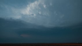 Lightning strikes as a supercell thunderstorm moves off into the distance. - Powered by Shutterstock - Get 15% off with code: PIKWIZARD15