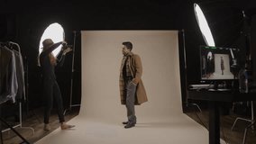 Bts photographer takes photo of model in studio