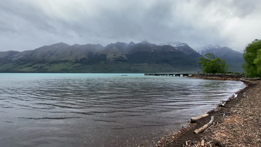 Beautiful landscape views at Glenorchy marina with mountain ranges at the background 
