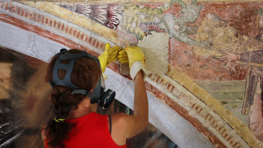 Restoration Process of Special Chemical Applications on a Church Arch Wall Ancient Fresco By Professional Female Restorer Wearing a Protective Gas Mask While Working Royalty-Free Stock Footage #3469427533