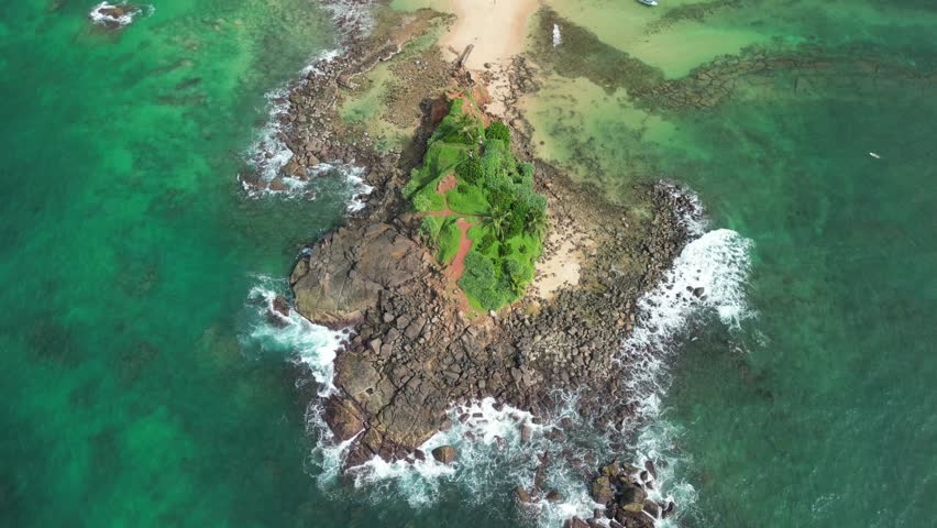 Aerial footage of Parrot Rock Island  located in Mirissa, Sri Lanka