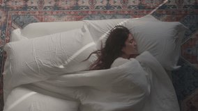 Woman sleeping in bed, stock video