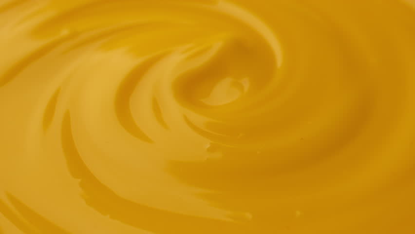 Zoom frame yellow cheese sauce, close up