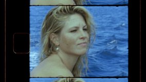 Vintage film clip of a portrait of a girl in a bathing suit on a boat