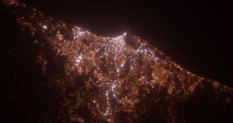 Durban (South Africa) aerial view at night. Top view on modern city with street lights. Camera is zooming out, rotating counterclockwise. Vertical video. The north is on the left side