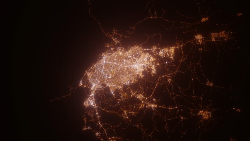 Barranquilla (Colombia) top view at night. View on modern city from satellite. Camera is zooming in, rotating counterclockwise. Vertical video. The north is on the left side