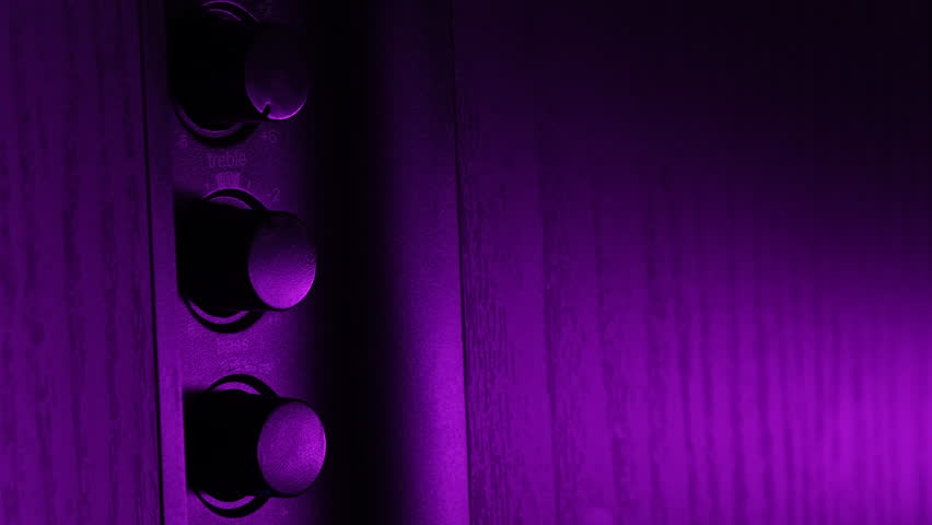 Purple-Lit Music Speaker's Volume And Tone Controls Royalty-Free Stock Footage #3469602723