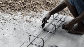 footage man's hands assemble a cast iron frame