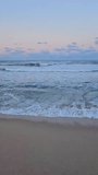 A video of the sea rippling under the autumn evening sky