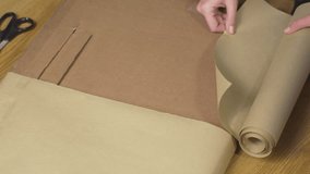 Cutting craft paper with scissors for gift wrapping - Powered by Shutterstock - Get 15% off with code: PIKWIZARD15