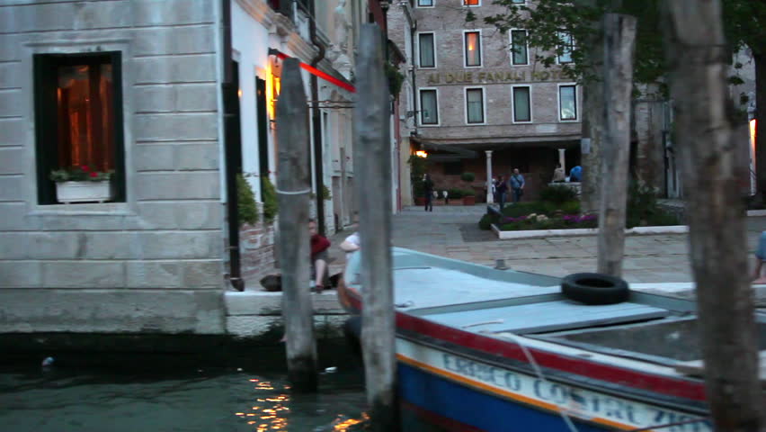 VENICE - MAY 2012: Tracking shot in Venice from canal at dusk. Shot includes: