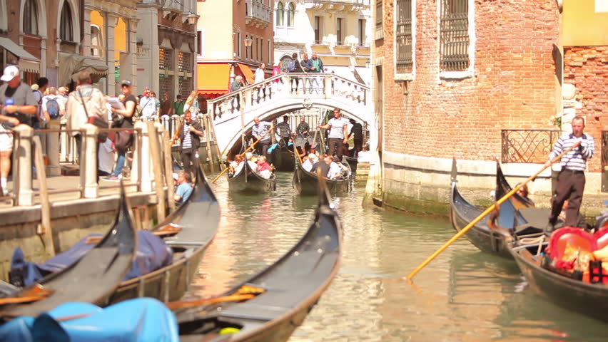 VENICE - MAY 2012: Riding in a Gondola on the canal. 