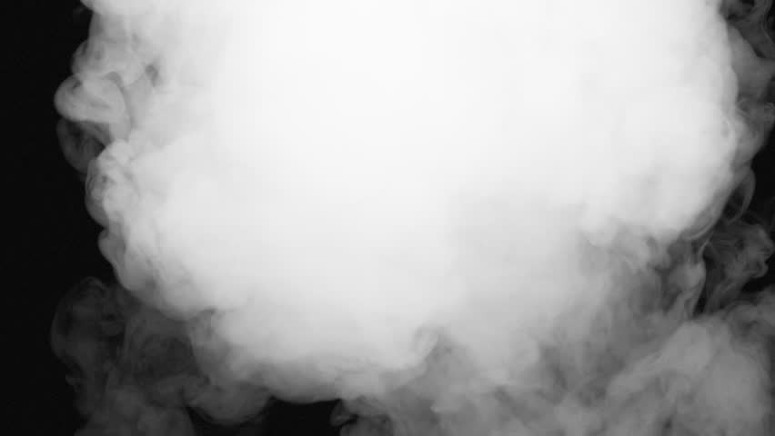 Plume of White Smoke Fills the Darkness. A stream of white smoke emerges from the darkness and moves straight into the camera, completely filling the screen with a white veil
