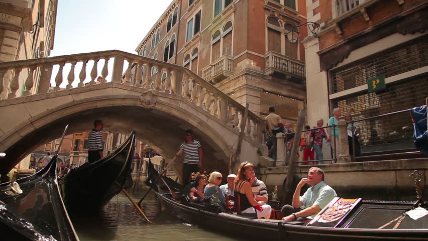 VENICE - MAY 2, 2012: Shot from a moving gondola as it passes underneath a