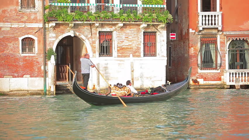 VENICE - MAY 2012: Gondolier with passenger in Venice.