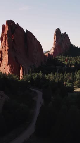 Vertical Flying Over Pines Garden of the Gods 4K features a view from a drone of the west side of Garden of the Gods in Colorado Springs at sunrise in a vertical ratio.