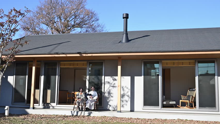 Autumn Winter Image of Daughter and Mother Caring for the Elderly Wide-angle video of parent and child having a friendly conversation	
