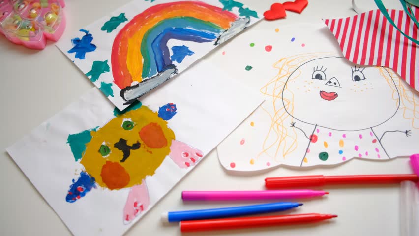 Child girl painting cute portrait, greeting card, flowers, gift for Mothers day, Birthday or Valentines day . Arts crafts concept. Top view table