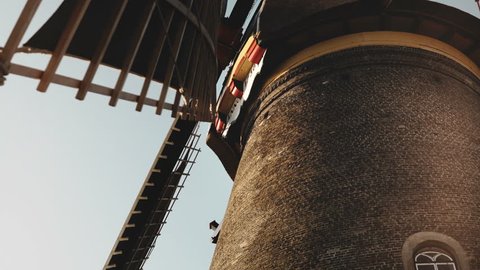 4K Close-up of traditional old rustic windmill. Netherlands. Dutch historical heritage. Tourism architecture landmark.