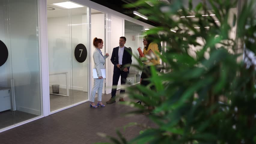 Diverse group engaging over an architectural model with sunlight streaming in. Business Team Discussing Architectural Model in Modern Office - Powered by Shutterstock - Get 15% off with code: PIKWIZARD15