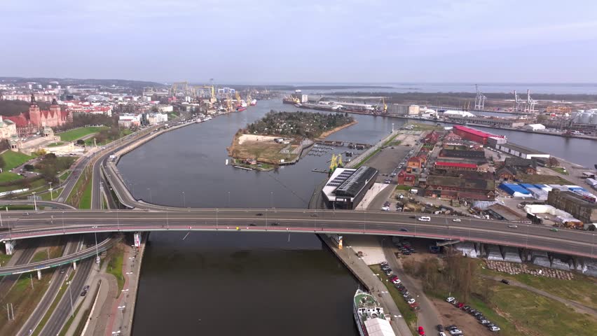 Aerial drone footage over the Oder River in Szczecin on a March day, capturing Szczecin Castle Route.