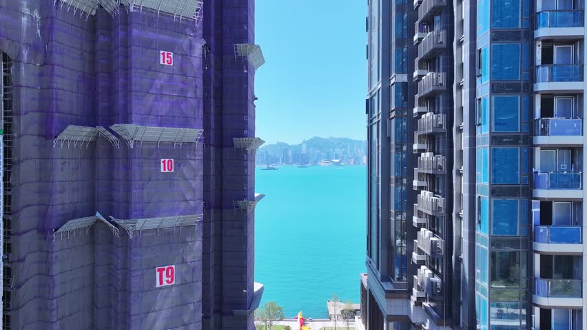 Seaside commercial residential construction project in Kai Tak Sports Park Cruise Terminal Hong Kong, Kwun Tong and Kowloon Bay near Victoria harbour, Aerial drone skyview
