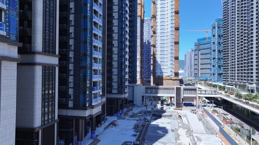 Seaside commercial residential construction project in Kai Tak Sports Park Cruise Terminal Hong Kong, Kwun Tong and Kowloon Bay near Victoria harbour, Aerial drone skyview