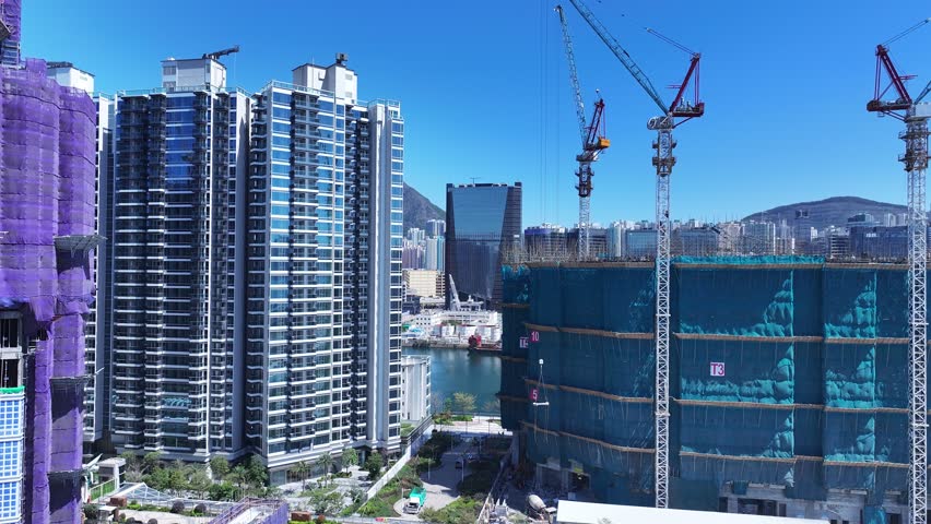Seaside commercial residential construction project in Kai Tak Sports Park Cruise Terminal Hong Kong, Kwun Tong and Kowloon Bay near Victoria harbour, Aerial drone skyview