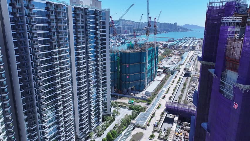 Kai Tak Construction Residential high-rise housing project along the seaside promenade near Victoria Harbour Hong Kong