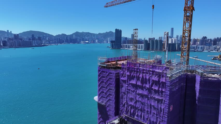 Kai Tak Construction Residential high-rise housing project along the seaside promenade near Victoria Harbour Hong Kong