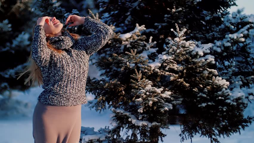 Woman enjoying winter day outdoors. | Shutterstock HD Video #34702435