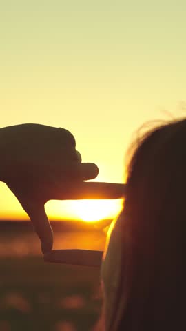 happy woman girl hair traveler shows hands gesture frame sunset dream, personal journey visual, handframe goal setting, sunset horizon target, life dreams silhouette, life path framing gesture