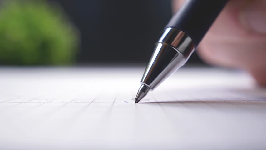 Sign a paper document with ball pen, extreme close-up shot
