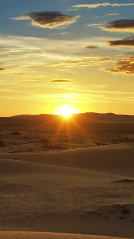 Aerial view of beatiful sunrise in desert, Mongolia. Vertical video