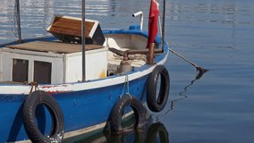 Seagull is the Guest of the Wooden Ffishing Boat Moored in the Harbor in the Ocean Footage.