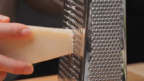 Cheese. Parmesan. Grate the cheese. Hard cheese. Cooking. Italian cuisine. Cooking. Close-up. Yellow cheese.  - Powered by Shutterstock - Get 15% off with code: PIKWIZARD15