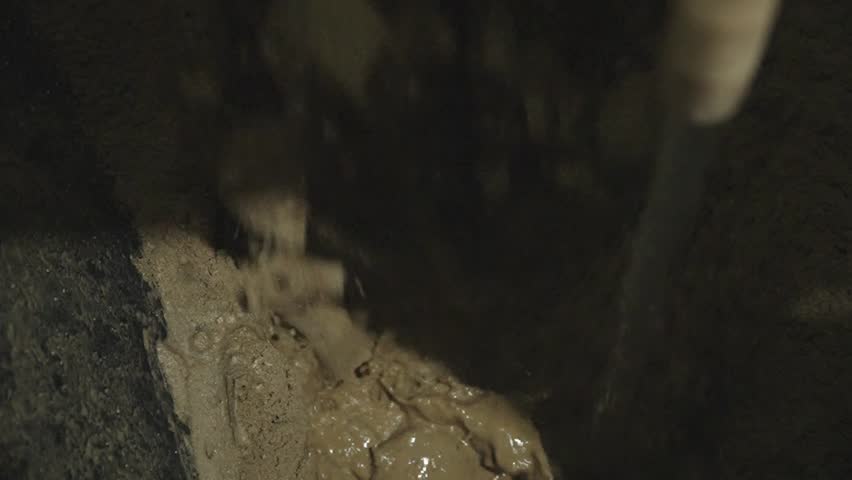 Combining water and a crushed mixture of stones and sand to make aerated concrete blocks Royalty-Free Stock Footage #3470738893
