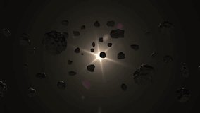 Asteroids in deep space and sun. Fly around a group of asteroids in deep space with the sun in the background.