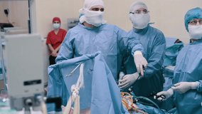 Video endoscopic surgery. A surgeon performs an operation to remove the gallbladder in the clinic. 