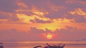 The beautiful sunrise above the fishing boats was accompanied by the beautiful sight of clouds in the beautiful sky
I could see the big, bright sun rising over the horizon in the distance.
