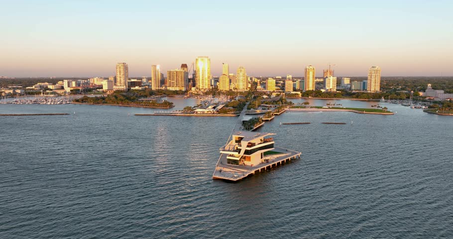 Sunrise at Saint Petersburg, Florida pier with downtown skyline in the background, aerial perspective.