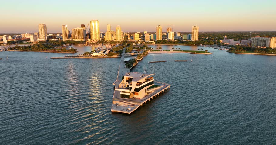 Sunrise at Saint Petersburg, Florida pier with downtown skyline in the background, aerial perspective.