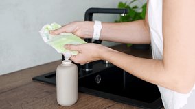 Woman pours soap or detergent from the recycled packaging into a reusable bottle. Eco-friendly lifestyle concept. High quality 4k footage - Powered by Shutterstock - Get 15% off with code: PIKWIZARD15