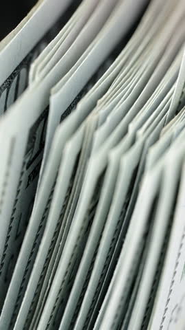 Bill Counter money close up. Vertical video social networks. Bank automatic equipment. Macro view stack of hundred dollar bills counting 100 bills american currency. Money concept. Business finance