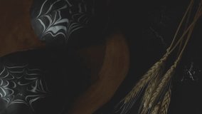 Spiderweb bread with dark chocolate. Sweet bread. decorated A white and dark chocolate. The cake is on a dark wooden table with A cup of tea. With dark background  - Powered by Shutterstock - Get 15% off with code: PIKWIZARD15