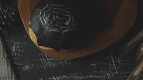 Spiderweb bread with dark chocolate. Sweet bread. decorated A white and dark chocolate. The cake is on a dark wooden table with A cup of tea. With dark background  - Powered by Shutterstock - Get 15% off with code: PIKWIZARD15