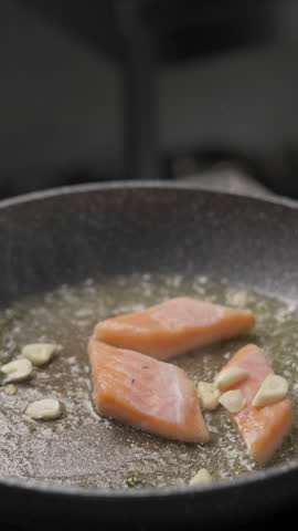 Cooking seafood-shrimp and salmon fish in a frying pan on butter. Seafood recipe. Vegetarian and diet food concept.