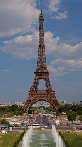 Vertical footage for story and reel of Eiffel Tower. The famous Paris eiffel tower in France. Time lapse of the tower Paris, France. Tourists enjoy historical landmark and symbol of Paris